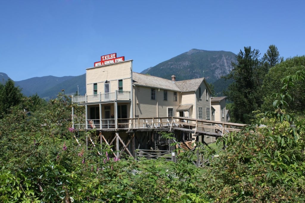 The historic Kilby general store building below forested mountains